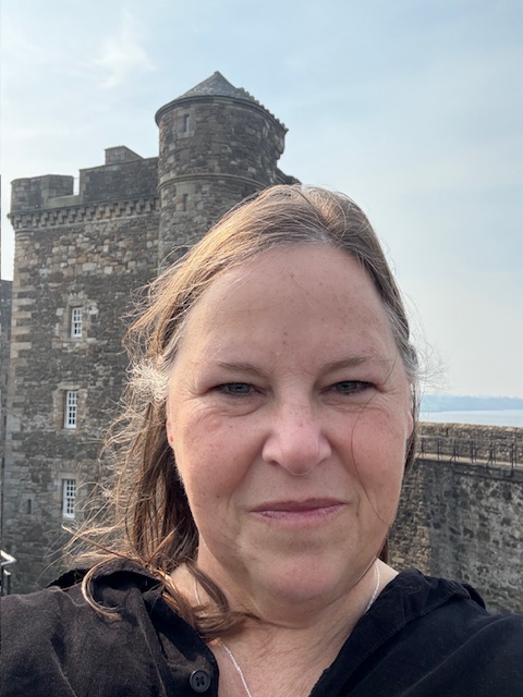 author standing in front of a Scottish castle
